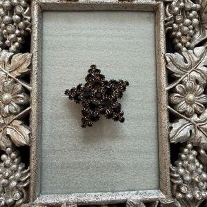 Vintage Black Rhinestone Star Brooch with Gold Tone Prongs